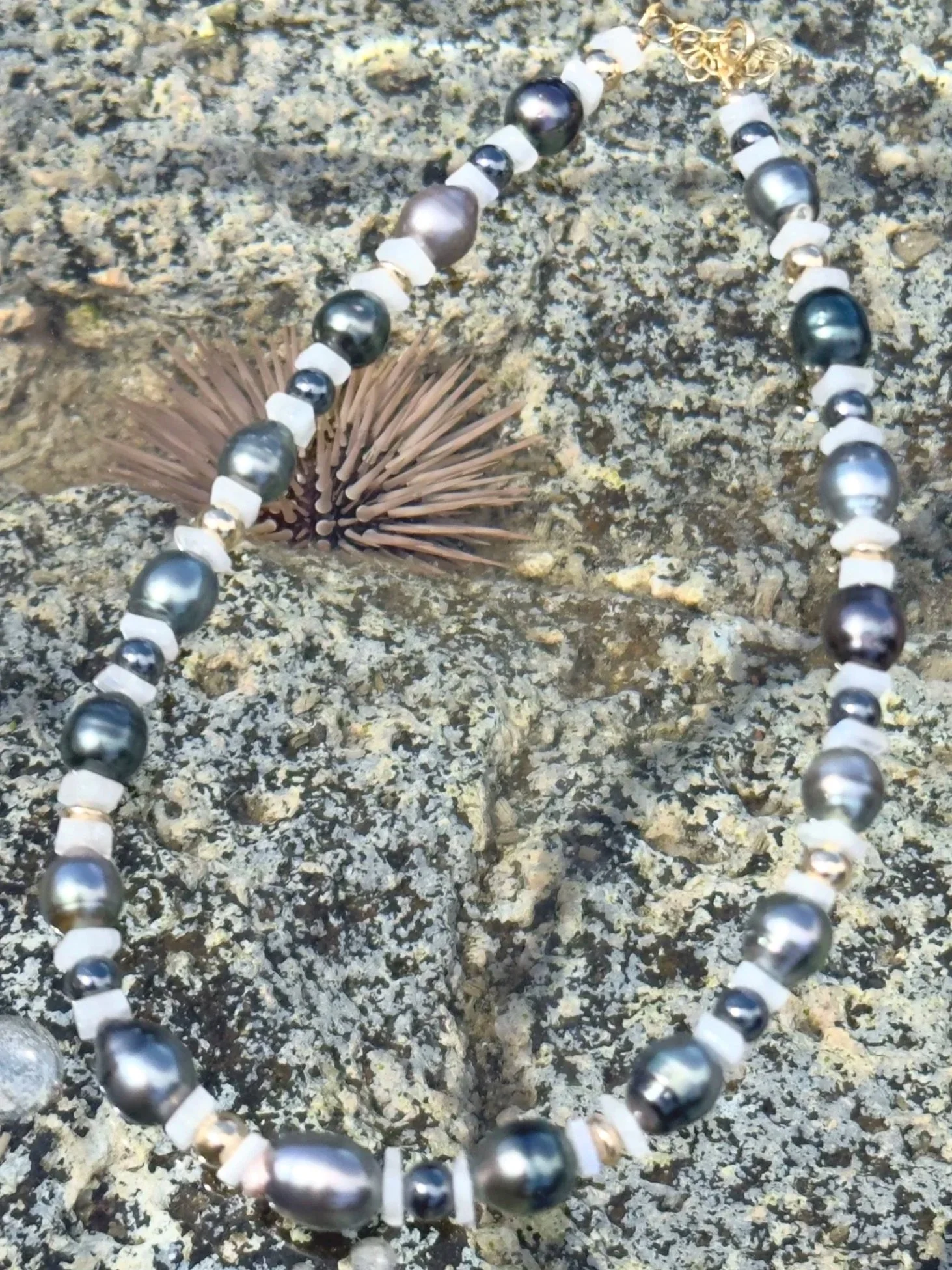 Close-up of Tahitian Pearl Moonstone Hematite Necklace, highlighting luminous pearls, rainbow moonstone chips, and sterling silver beads