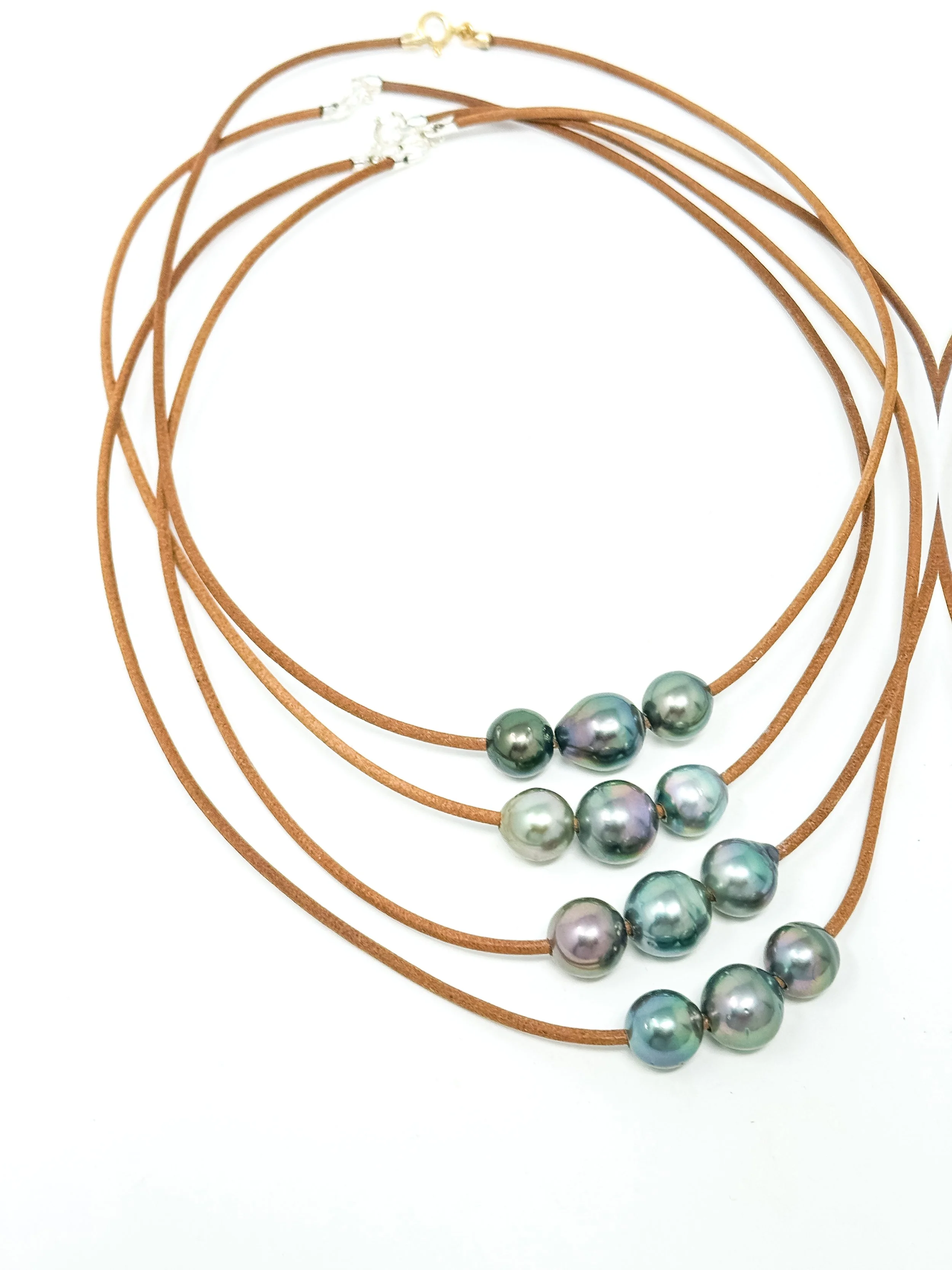 Thin leather necklace with three lustrous Tahitian pearls and 14K gold fill clasp handmade in Hawaii