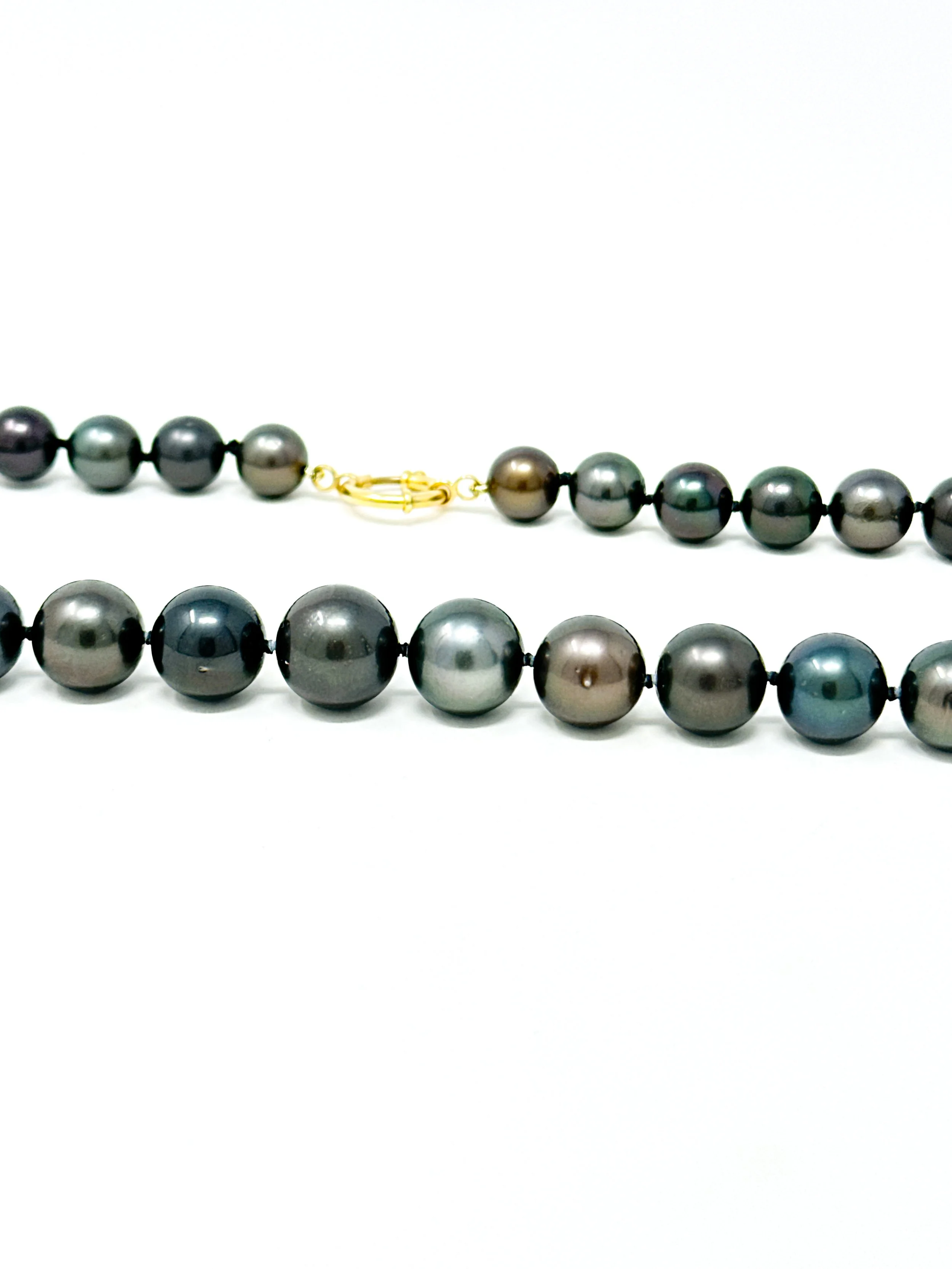 Solid 14K gold spring ring clasp detail on Tahitian pearl strand necklace