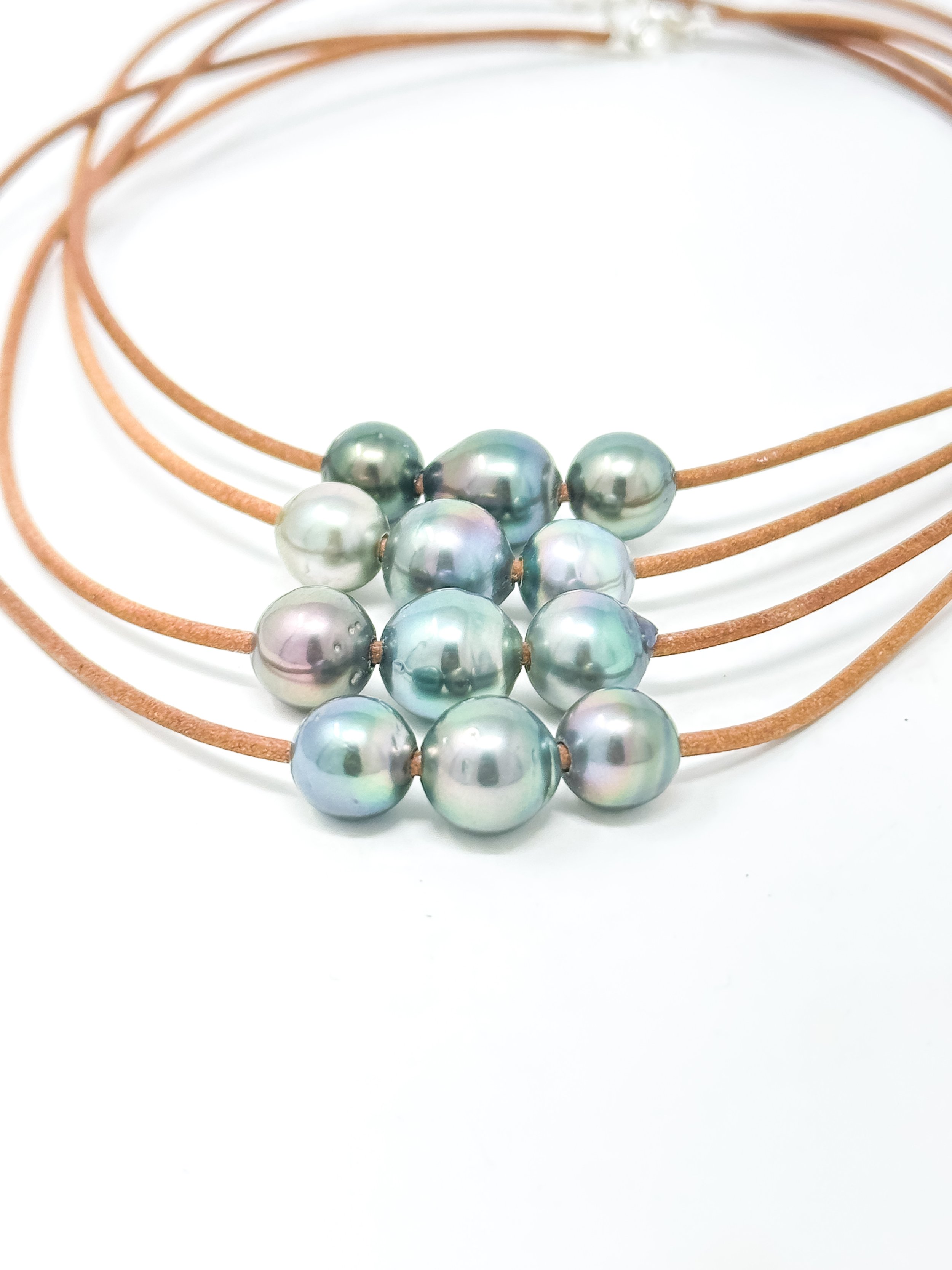 Handmade Hawaii necklace with thin leather cord and three lustrous Tahitian pearls