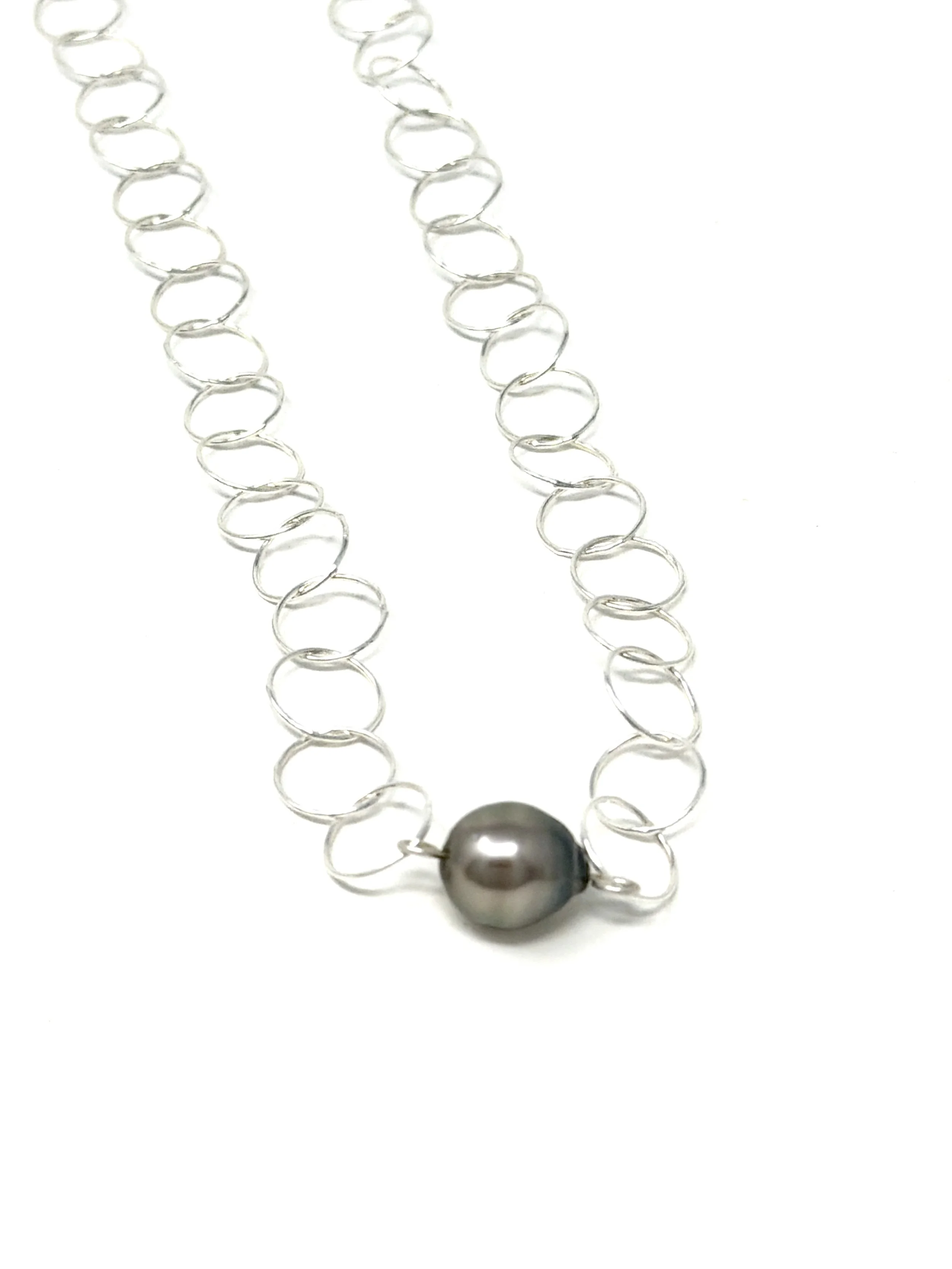 Handmade Endless Circles Necklace featuring a unique Edison, Tahitian, or Keshi pearl. 14K gold fill or sterling silver, adjustable for layering.