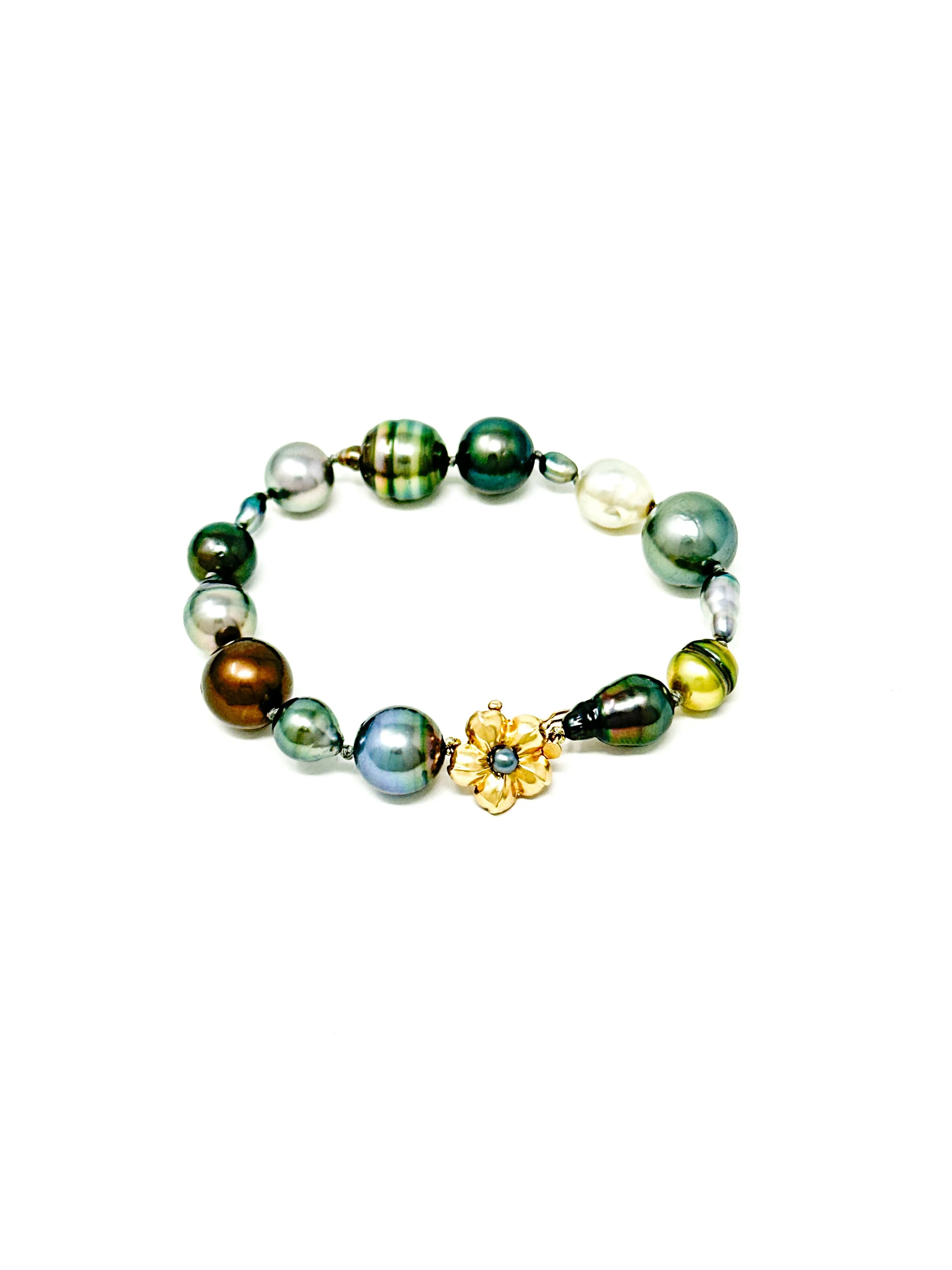 Tahitian mixed shape pearl bracelet featuring baroque, round, and keshi pearls with 14K gold flower clasp