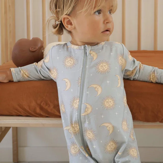 blue_yellow_celestial_sun_moon_zippy_baby_bamboo_jumpsuit.webp