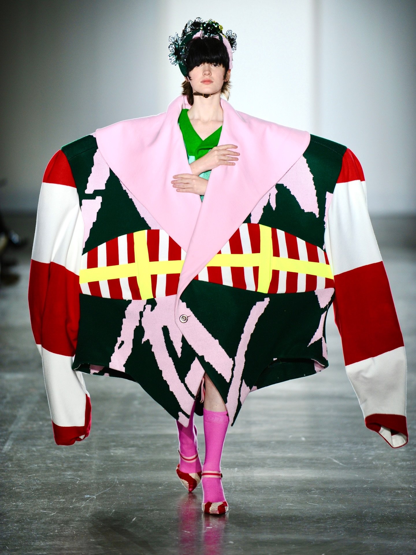 ➕ONES TO WATCH CATWALK SHOW: Min-Ji Kim

Knitwear, but not as you know it.

Korean-born, London-based designer Min-Ji Kim builds garments that don&rsquo;t just dress the body, they claim space. Sculptural knits explode in colour, texture and scale, t
