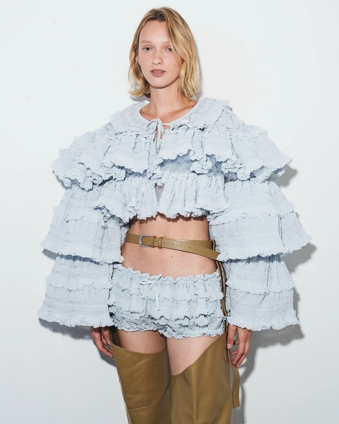 Soft ruffles, sculpted denim and exaggerated proportions @aknvas is bringing a playful femininity back into focus.

Founded by Danish designer Christian Juul Nielsen, the brand mixes romantic silhouettes with a more utilitarian edge, creating pieces 