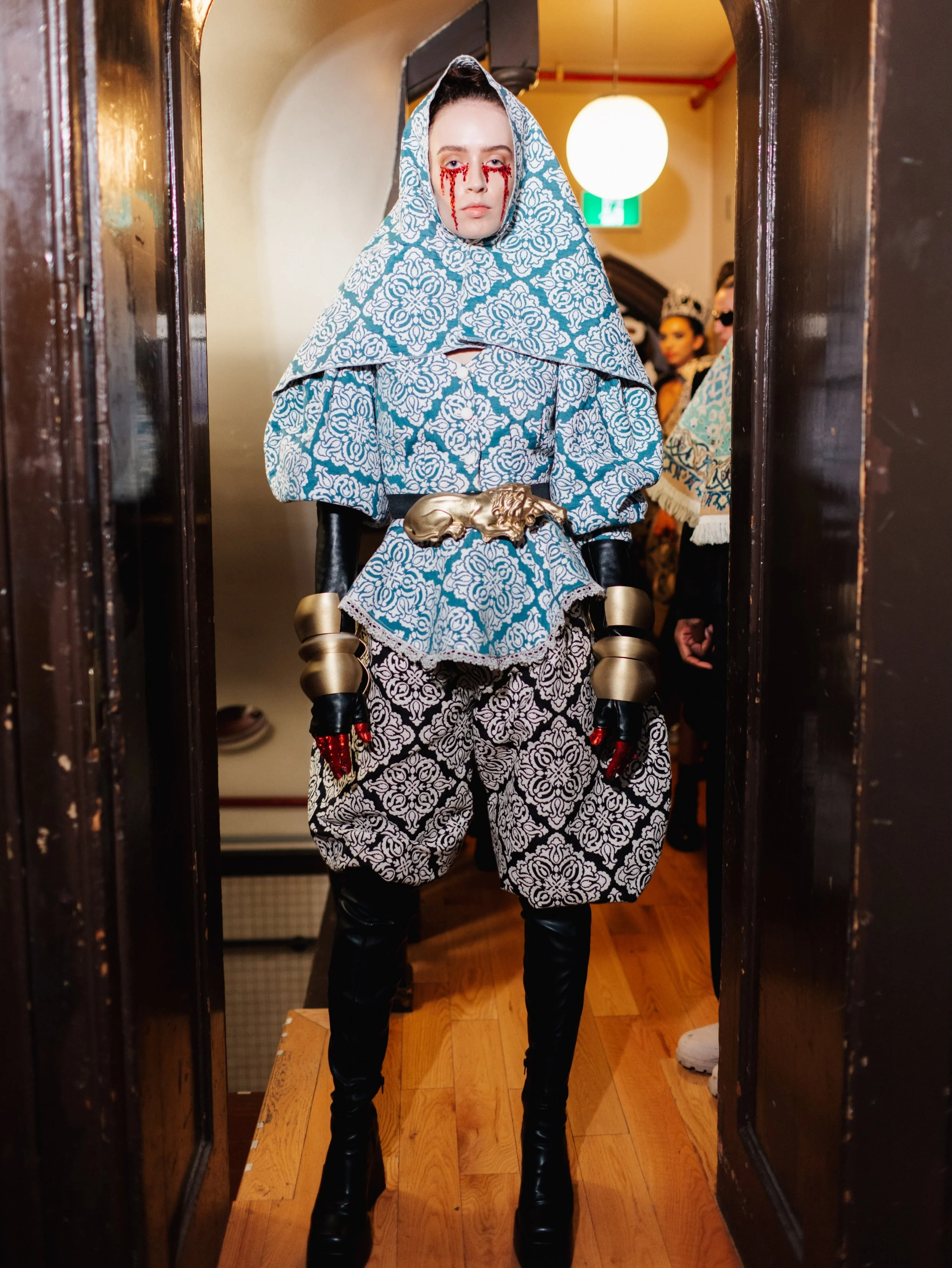 Persian textiles. Avant-garde silhouettes. Fashion as storytelling.

For her Toronto Fashion Week runway debut, Iranian-Canadian designer DORIAN WHO transformed Persian rug motifs, cultural memory and personal history into a striking collection of sc