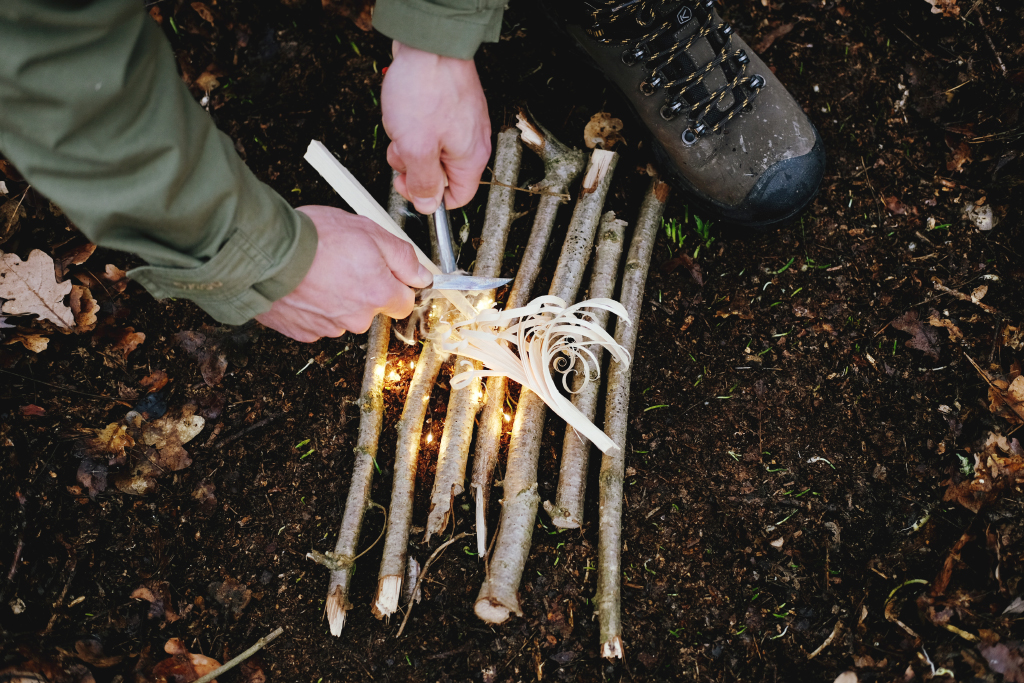   Lighting a fire with a fire steel and birch bark.  