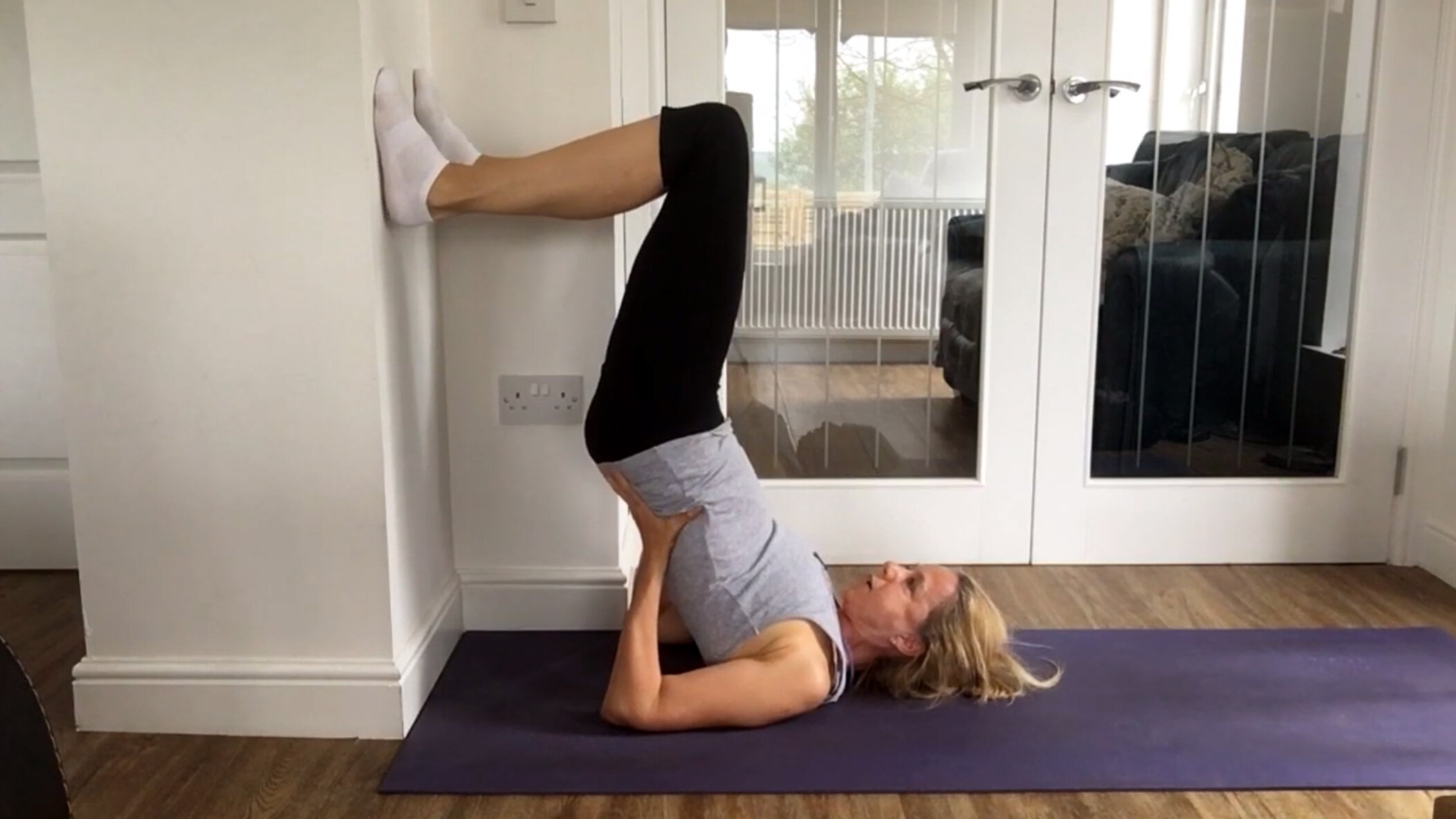 Woman practicing yoga doing the 