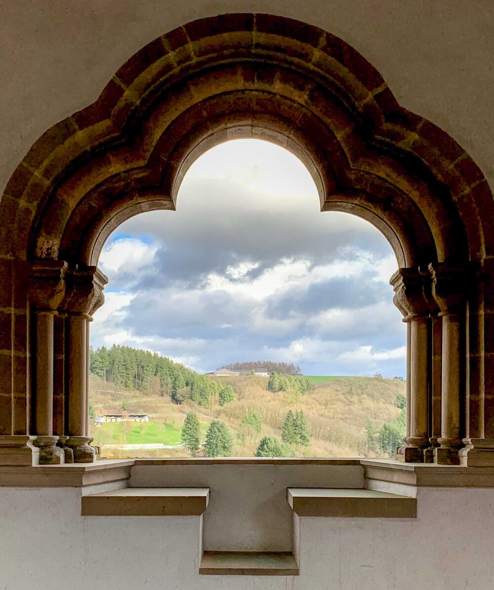Looking Through a Window of the Vianden Castle in Luxembourg.jpg