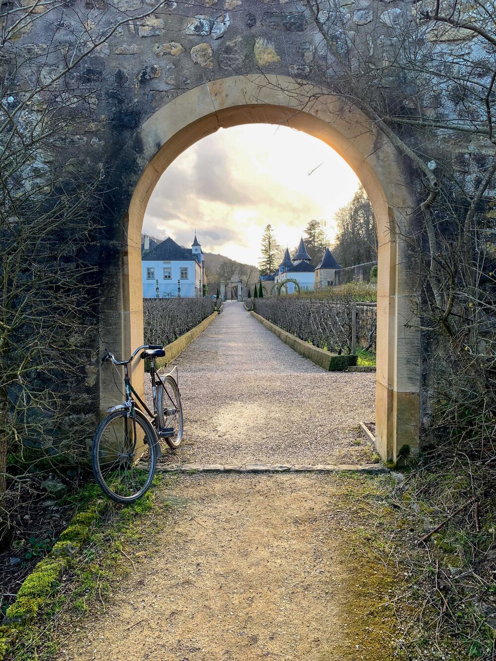 Bicycle & Archway Looking into the Gardens at Ansembourg Castle in Luxembourg.jpg
