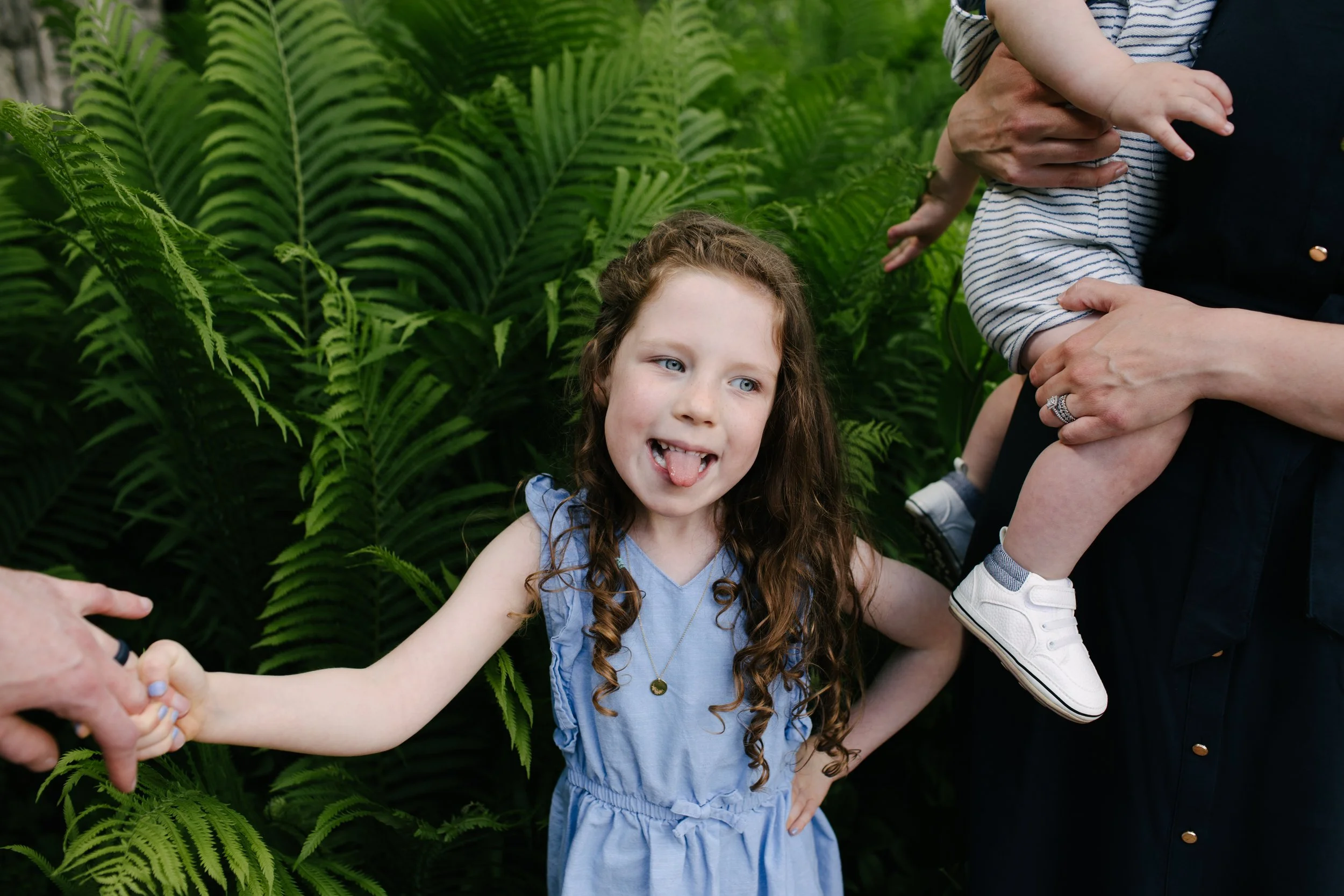 little girl sticking her tongue out