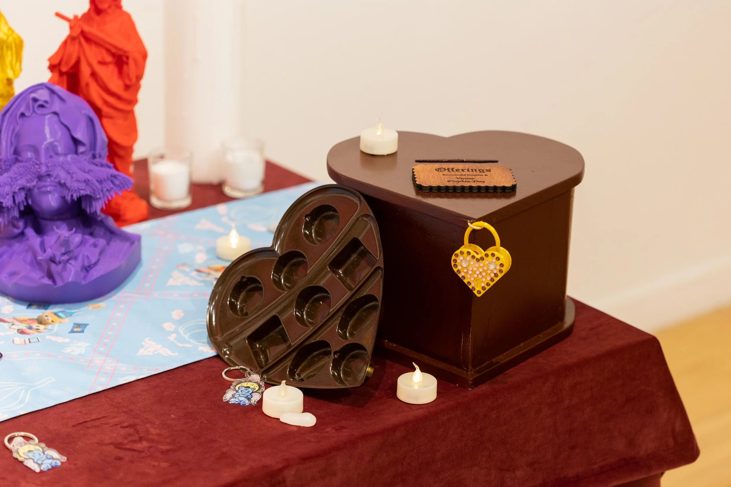 Detail of installation with wooden offering box