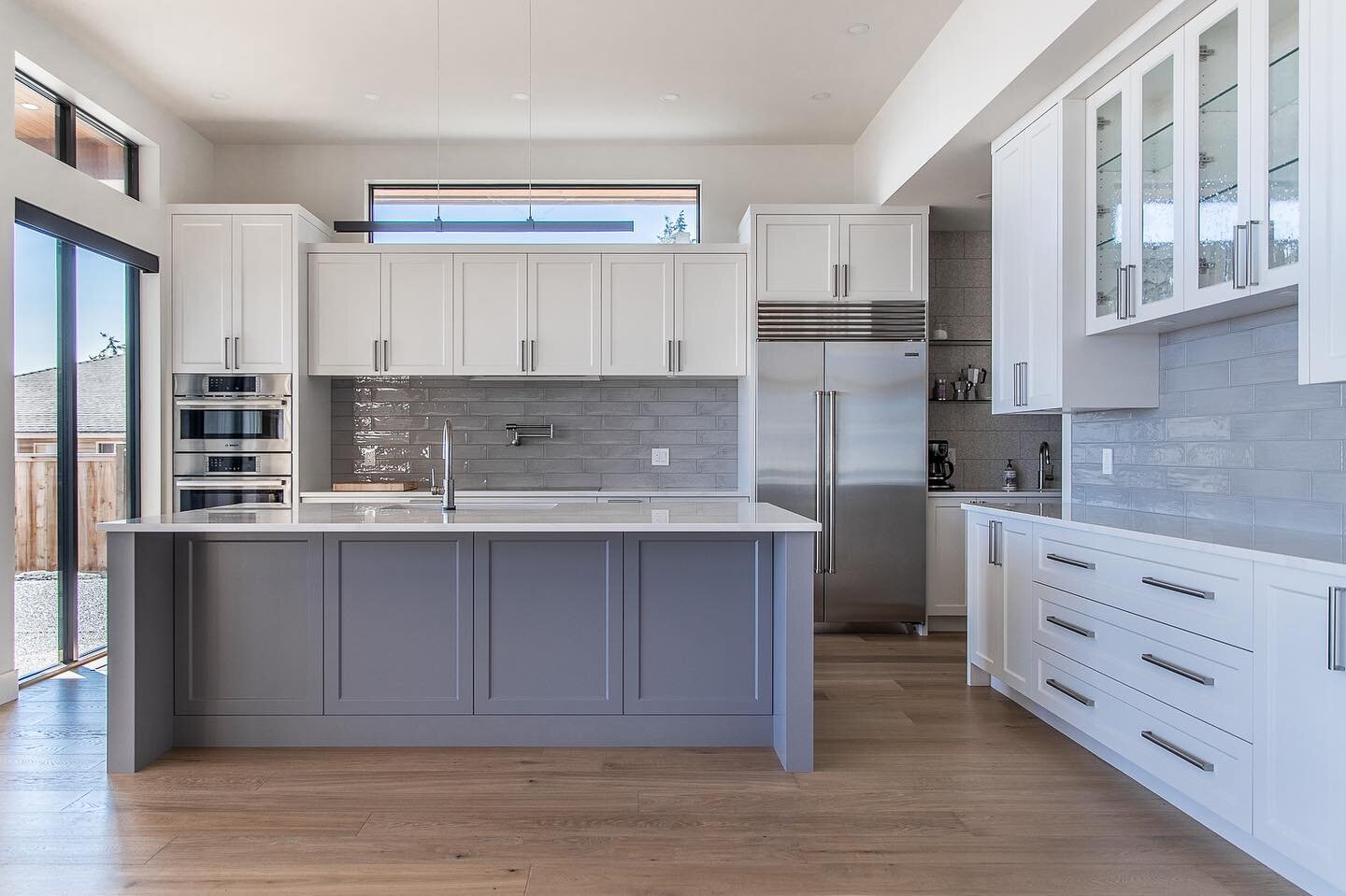Custom kitchen with oceanfront view #redfernmedia #customhome #customcabinets #kitchenwithaview
