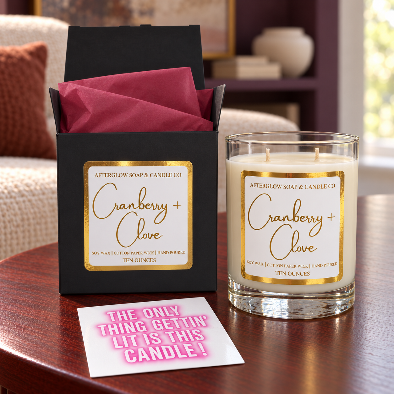 Cranberry+ Clove candle with matching open gift box, cranberry tissue and quote card.