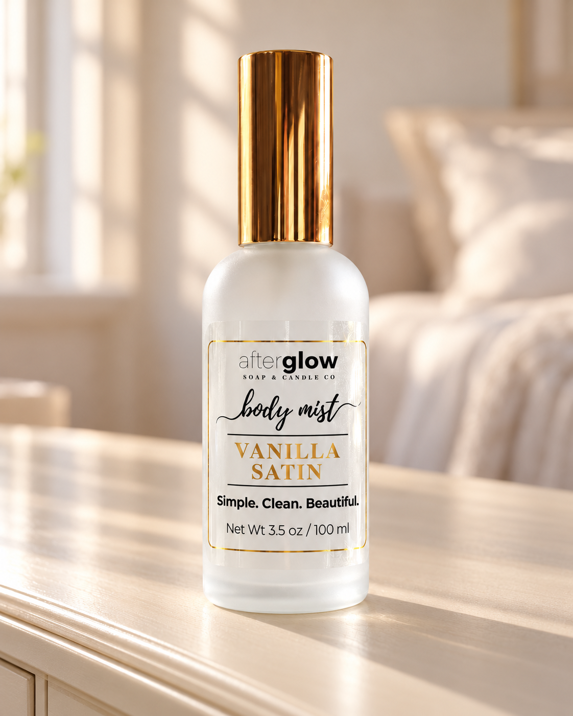 Afterglow Vanilla Satin body mist in a frosted glass bottle with gold cap and gold-foil label details.