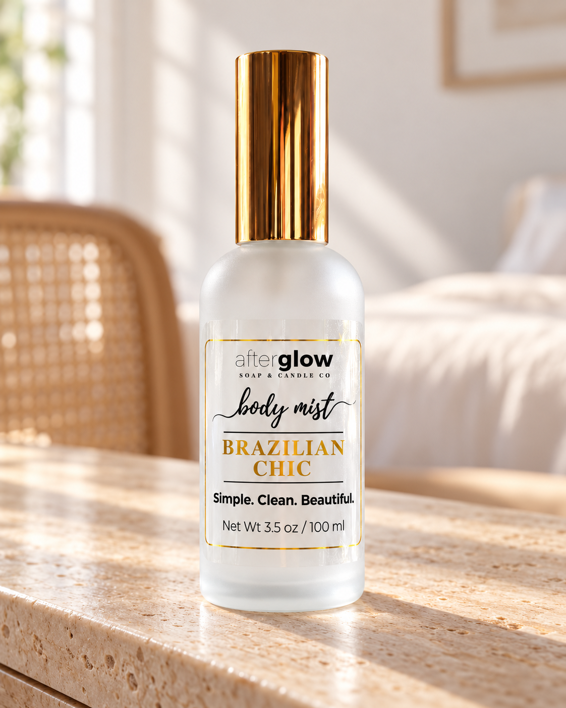 Afterglow Brazilian Chic body mist in a frosted glass bottle with gold cap and gold-foil label details.