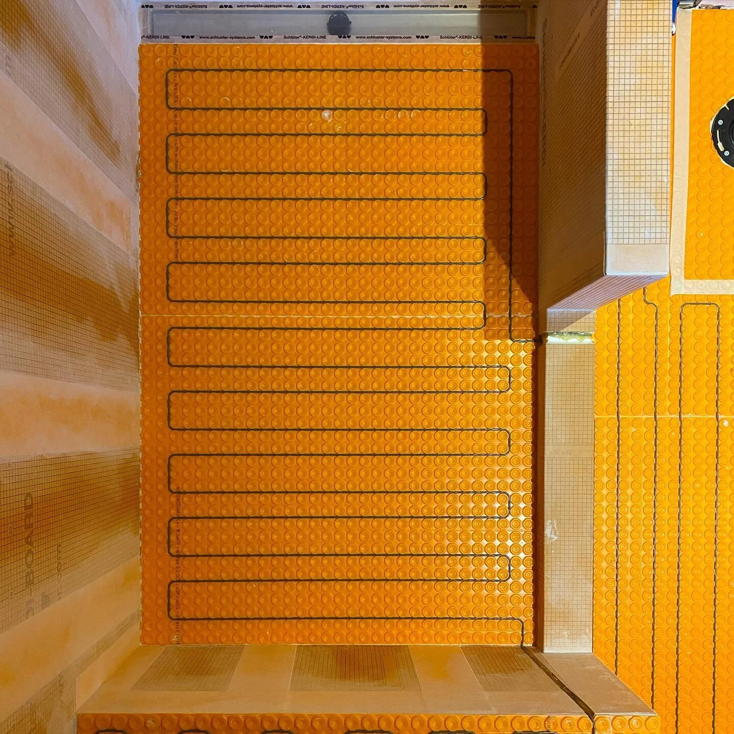 Progress shot from 1 of 3 washroom Reno&rsquo;s underway at our Lawrence park site. With most of the corners and fasteners water proofed and the ditra heat installed, just a bit more waterproofing to go around the shower floor and corners to wrap up 