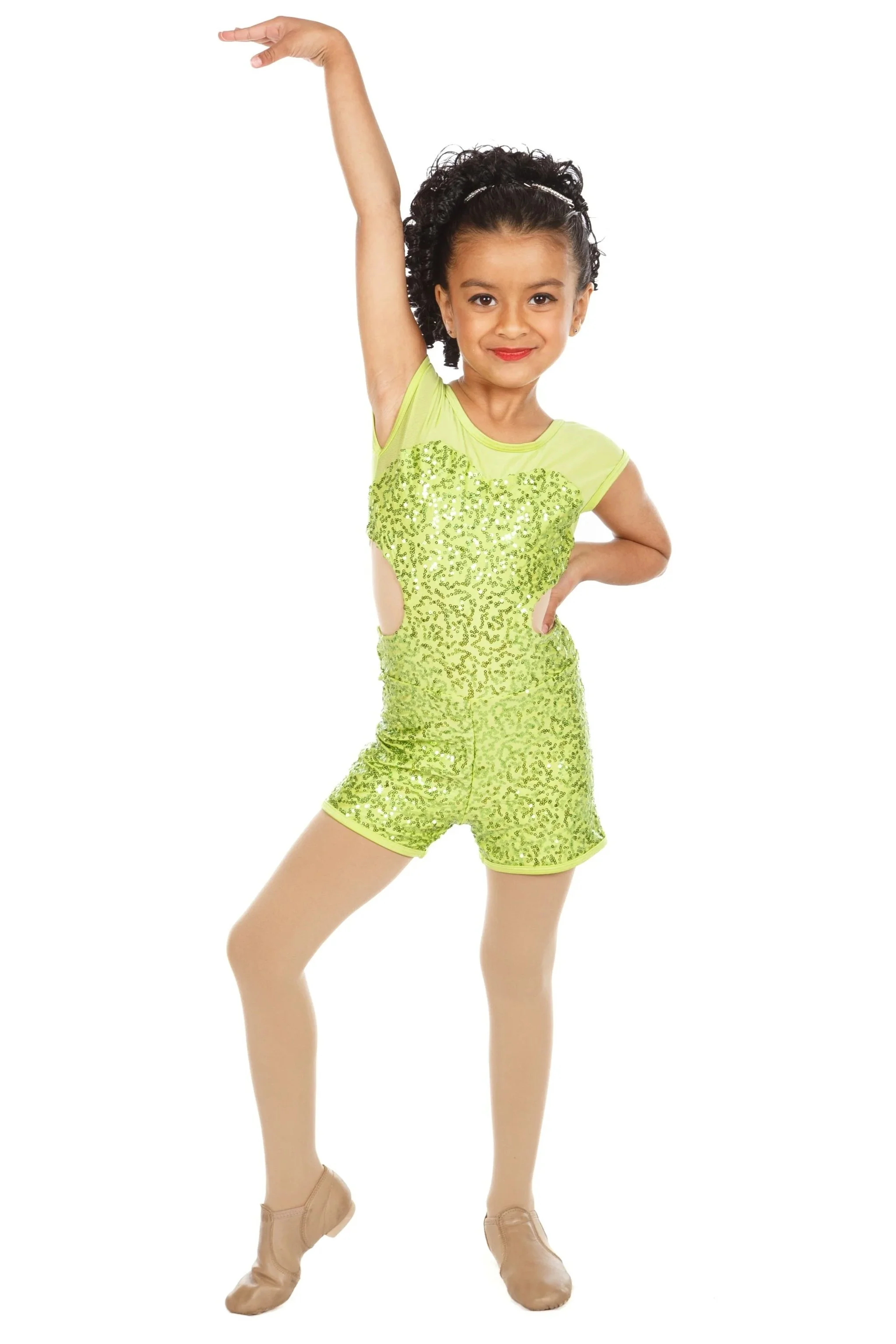 Dancer in a sparkly yellow dance costume with a pose, one hand on her hip, and the other raised above her head, wearing tan dance shoes, against a white background.
