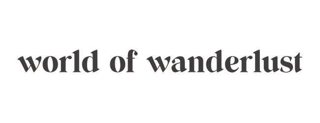 Black & white World of Wanderlust logo