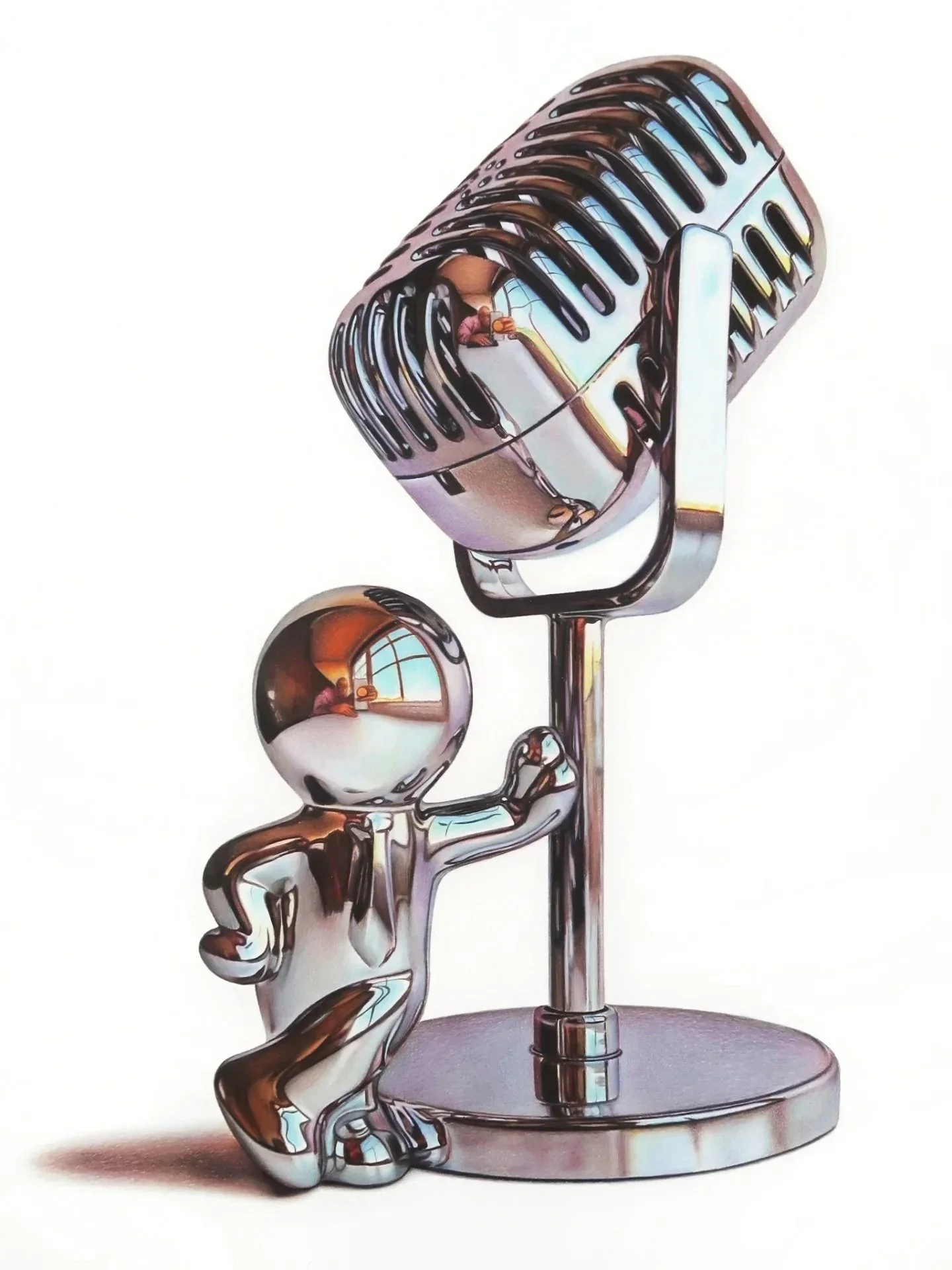 A shiny chrome sculpture of a human figure sitting on a stool with a large vintage microphone on a stand in front of it. The sculpture has reflective surfaces that show a window and a person taking the photo.