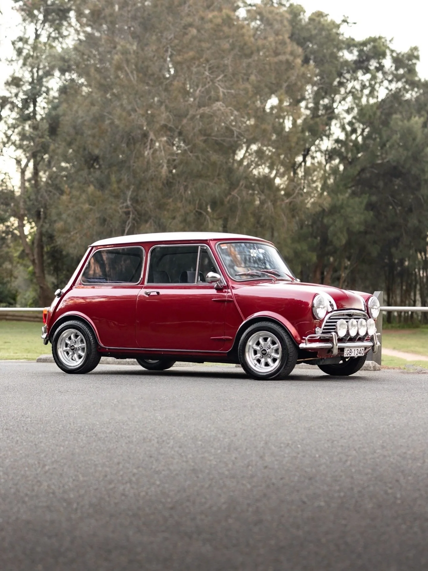 A fully restored 1961 Morris Mini finished in Rosso Monza 311, a classic Ferrari red. Supercharged, with a Moto-Lita steering wheel and gear shifter. Shot at sunrise in Narrabeen, Sydney.
If you&rsquo;ve got a classic or restoration you want a car ph