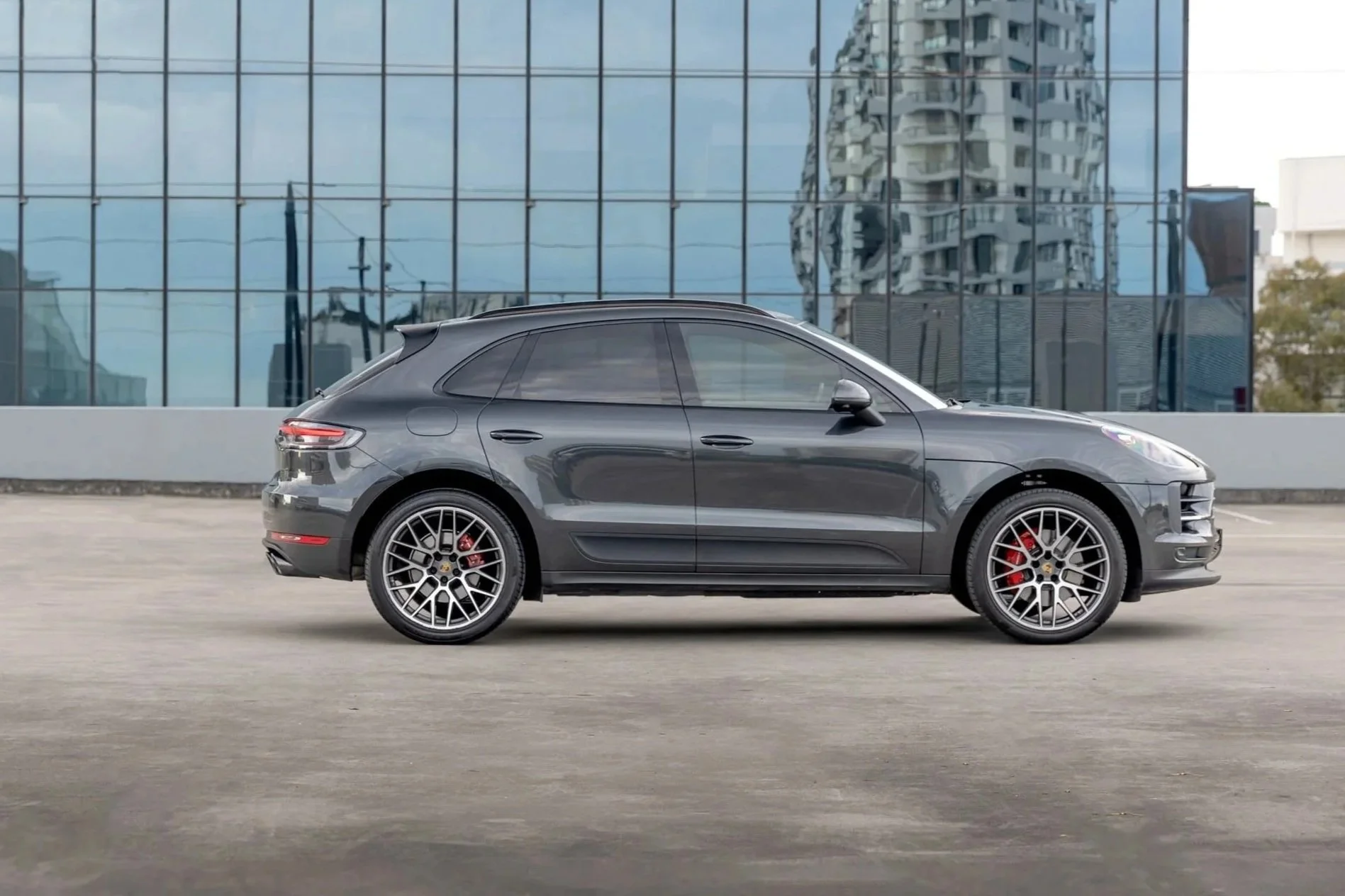 2019+Porsche+Macan+S+perfect+side+profile+in+Volcano+Grey+Metallic%2C+glass+building+reflection%2C+Sydney.jpg