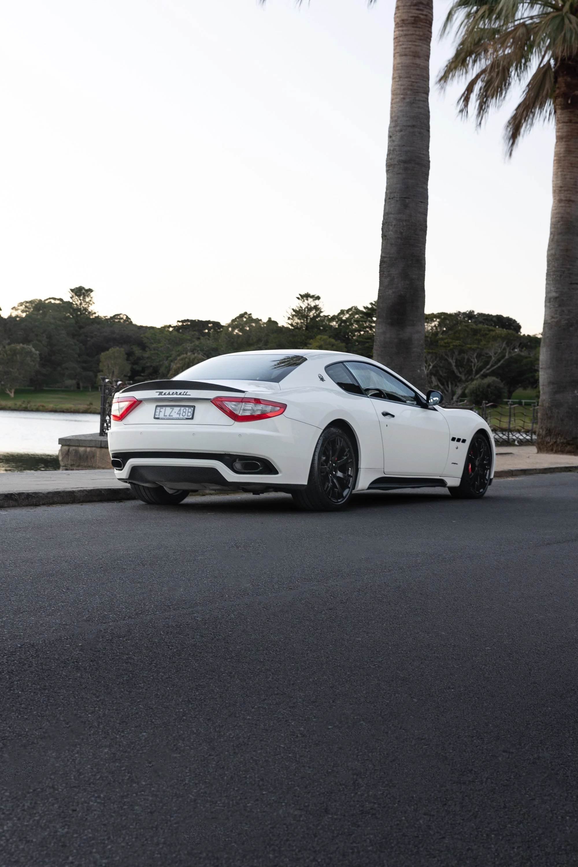 Maserati GranTurismo S rear three-quarter, lakeside parkland, automotive photographer Sydney
