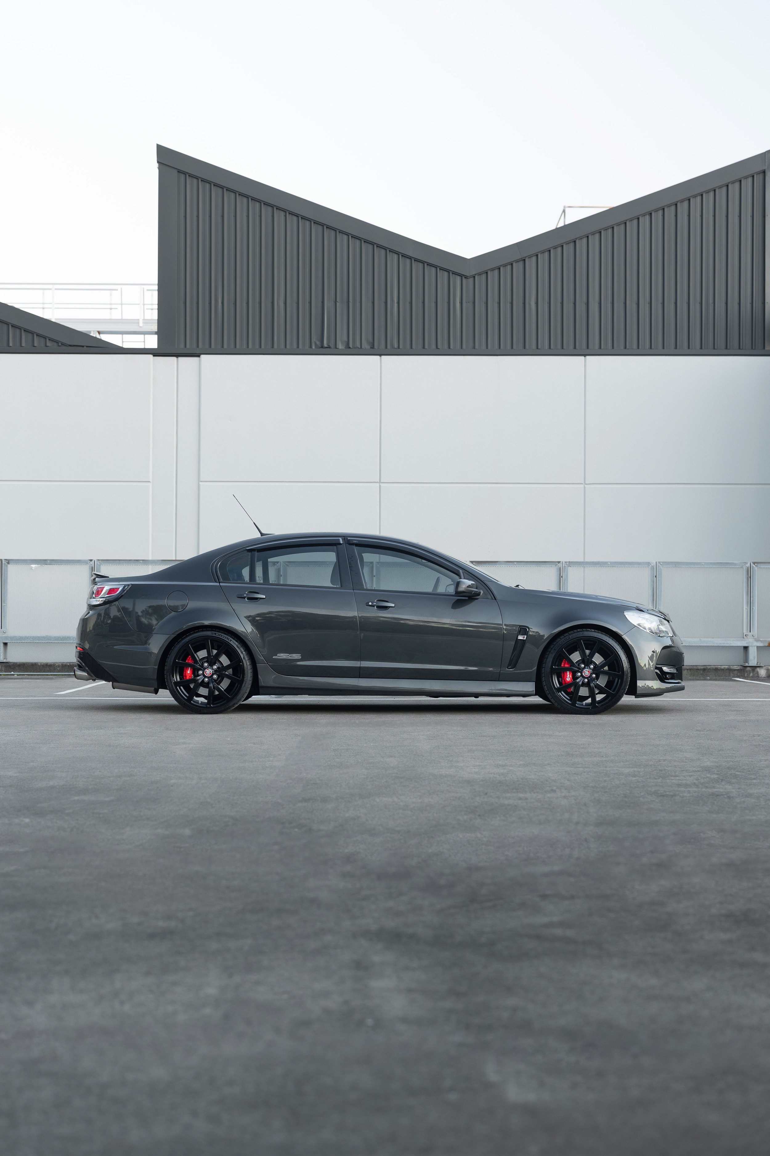Full side profile of a dark grey VF Series II Holden Commodore SS V Redline