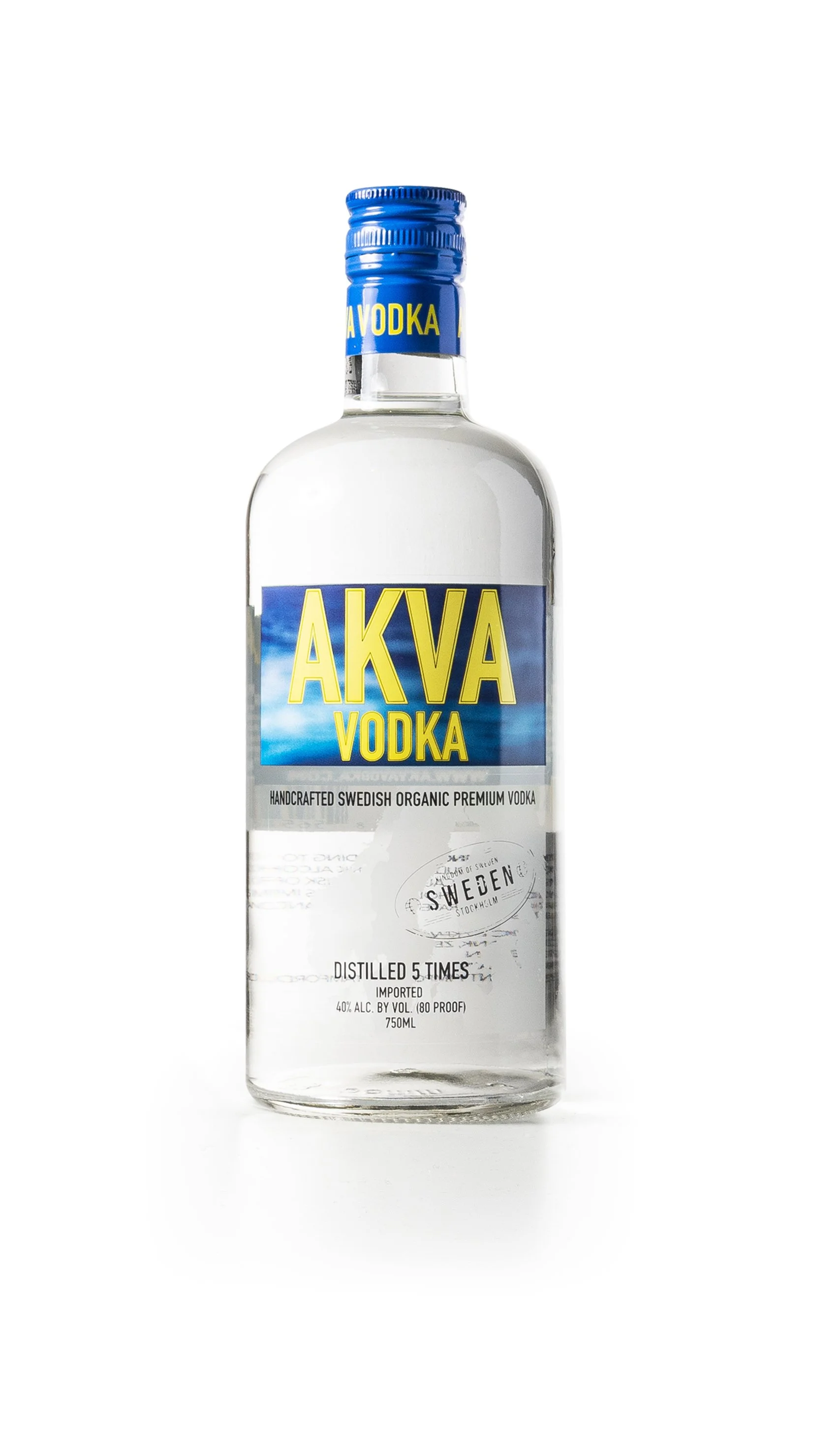 A clear glass bottle of Akva vodka with a blue and yellow label, depicting a cloudy sky, and a blue cap. The label states it is handcrafted Swedish organic premium vodka, distilled five times, 750ml, 40% alcohol.