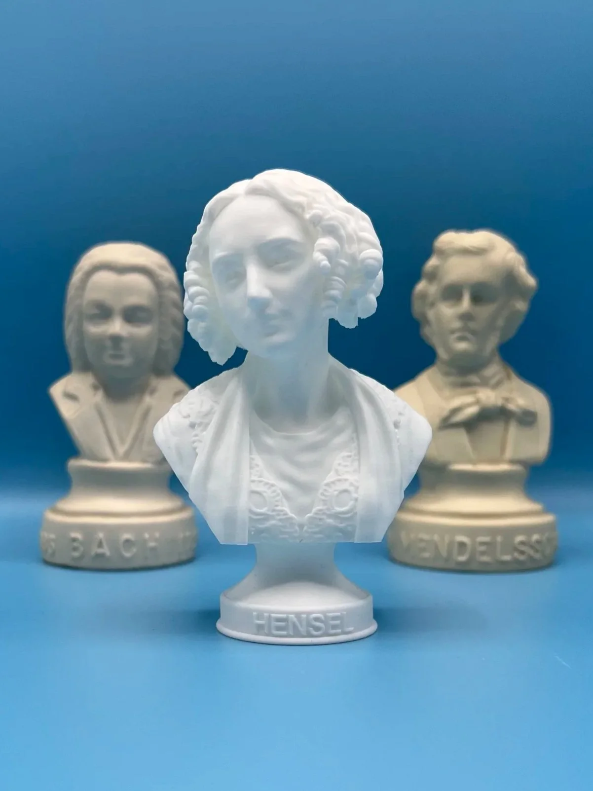 bust in front of Bach and Felix busts