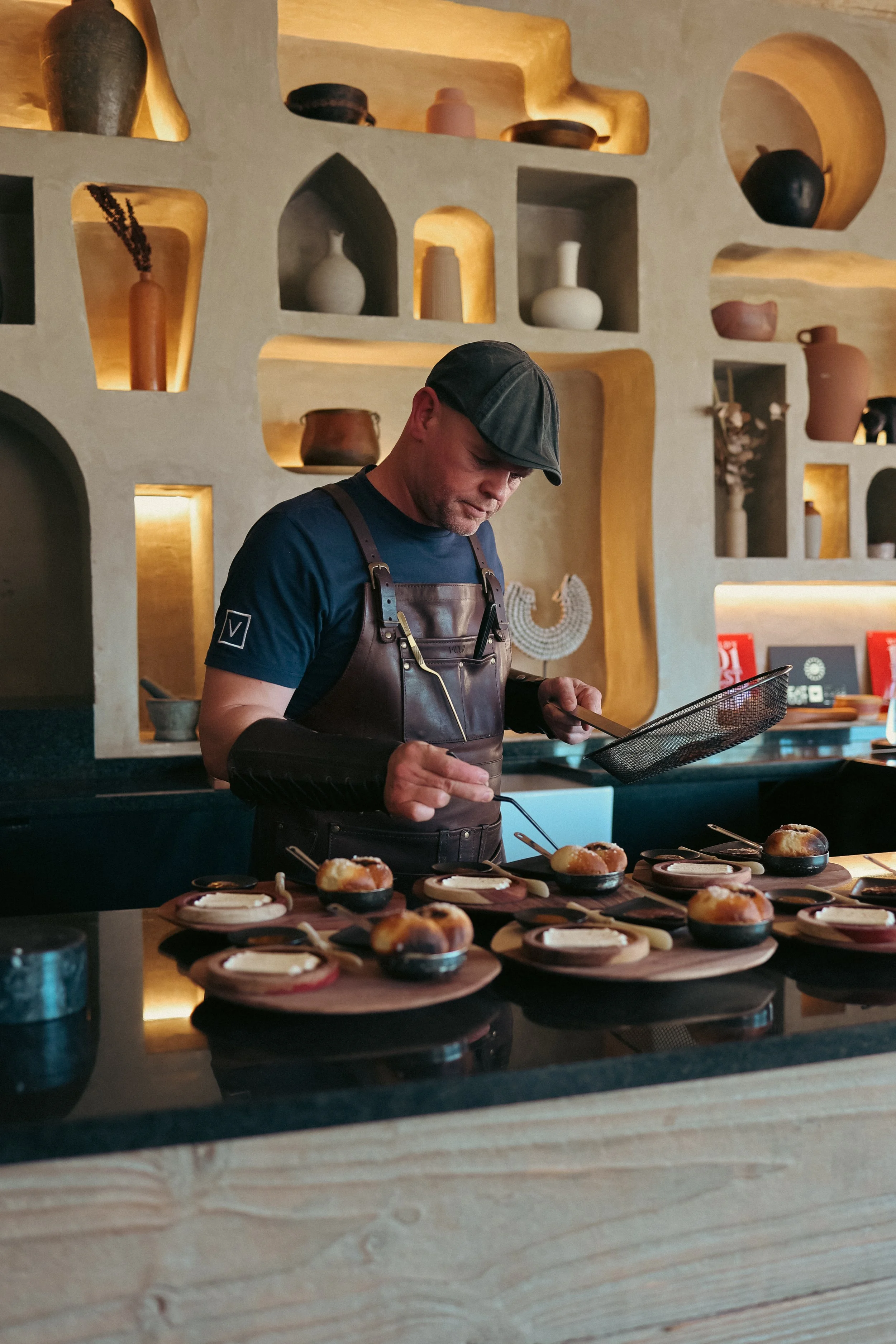   Shaun scrooby  
  not everyday a man can say, welcome to my island  
  In the winelands of Stellenbosch, tucked among vines and rolling hills, a fire burns that is more than just flame. It is a hearth, a performance, a philosophy. Its name is VUUR,