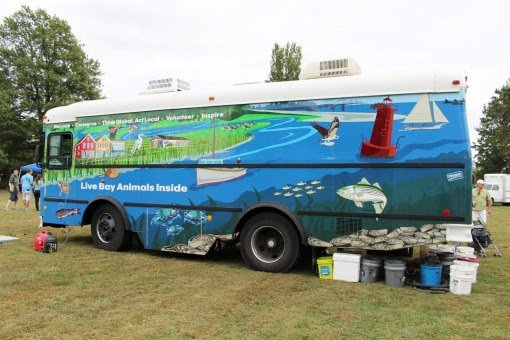 A truck of live bay animals stationed at the festival grounds.