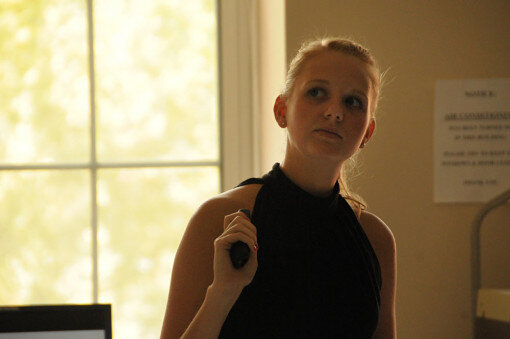Megan considers how to respond to a question.