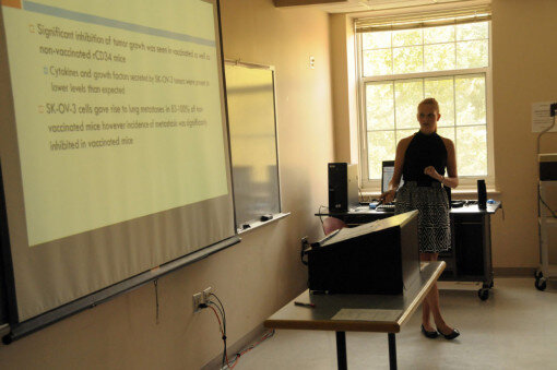 She returns to a previous slide to help clarify one of the concepts from the research.