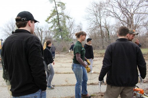 Students get to work on the dead plants & trash behind the Armory.