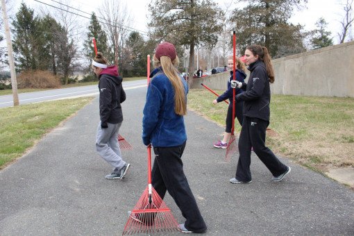 Armed with rakes, these students prepare to clean up the Armory lawn.