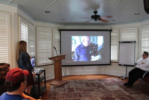 After introducing the event, Interim Director Dr. James Hall and English Department Head Dr. Kathryn Moncrief show a video of Bennett discussing the origins of May Day.