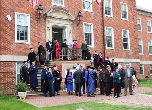 Faculty members set up for a procession.