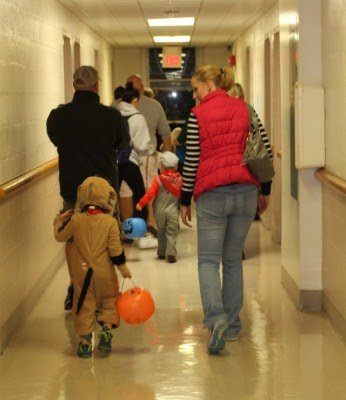 Adults and children alike flood the halls of Minta Martin in search of candy.