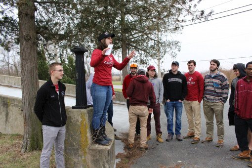 SGA Secretary of Service Audrey Utchen tries to get everyone's attention to start the cleanup.