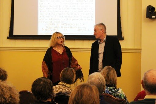 Ned looks to his wife Constance as she answers questions.