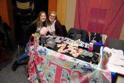 Alexis Young (left) and Bekah Nesbit (right) talk to prospective students at Zeta Tau Alpha’s table