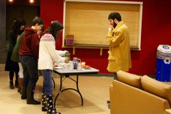 Students enjoy some refreshments before the dinner.