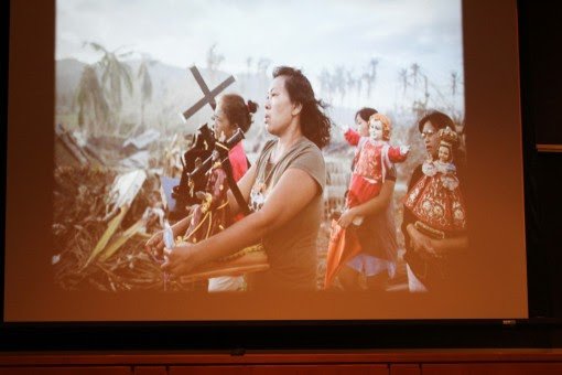 The women come together to pray after a destructive hurricane