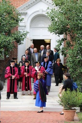 President Sheila Bair and faculty share a joke.
