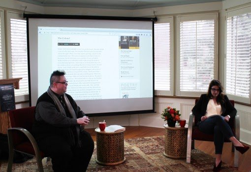 The talk began when Professors Wade and Hall played a reading of "The Colonel," by Carolyn Forché.