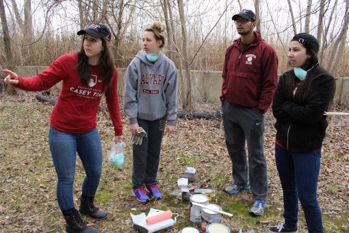 Audrey directs a group of students preparing to paint.