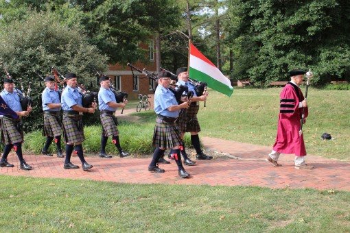 Bagpipe players, led by Dr. Richard Gillin, Professor of English.