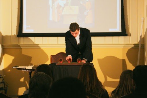 Flinn makes red balls magically disappear from cups