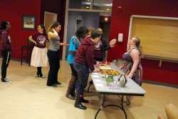Students try out the homemade American dishes.